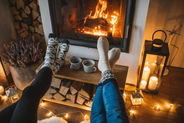 a room with a fire place in the middle of it